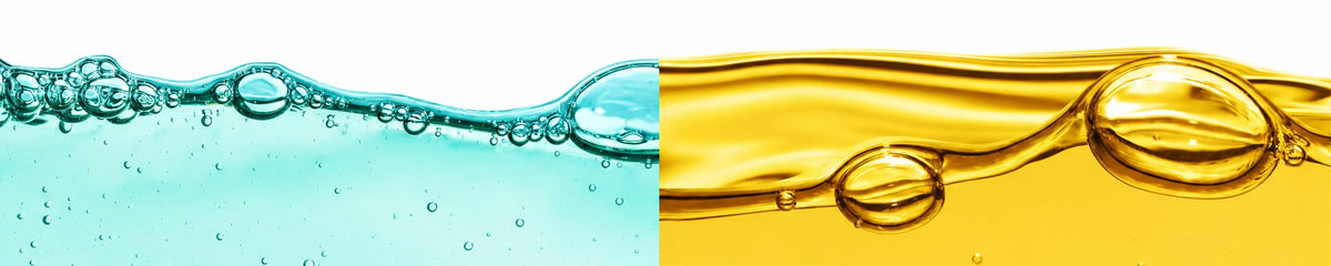 Agua cristalina y aceite esencial dorado, uno junto al otro